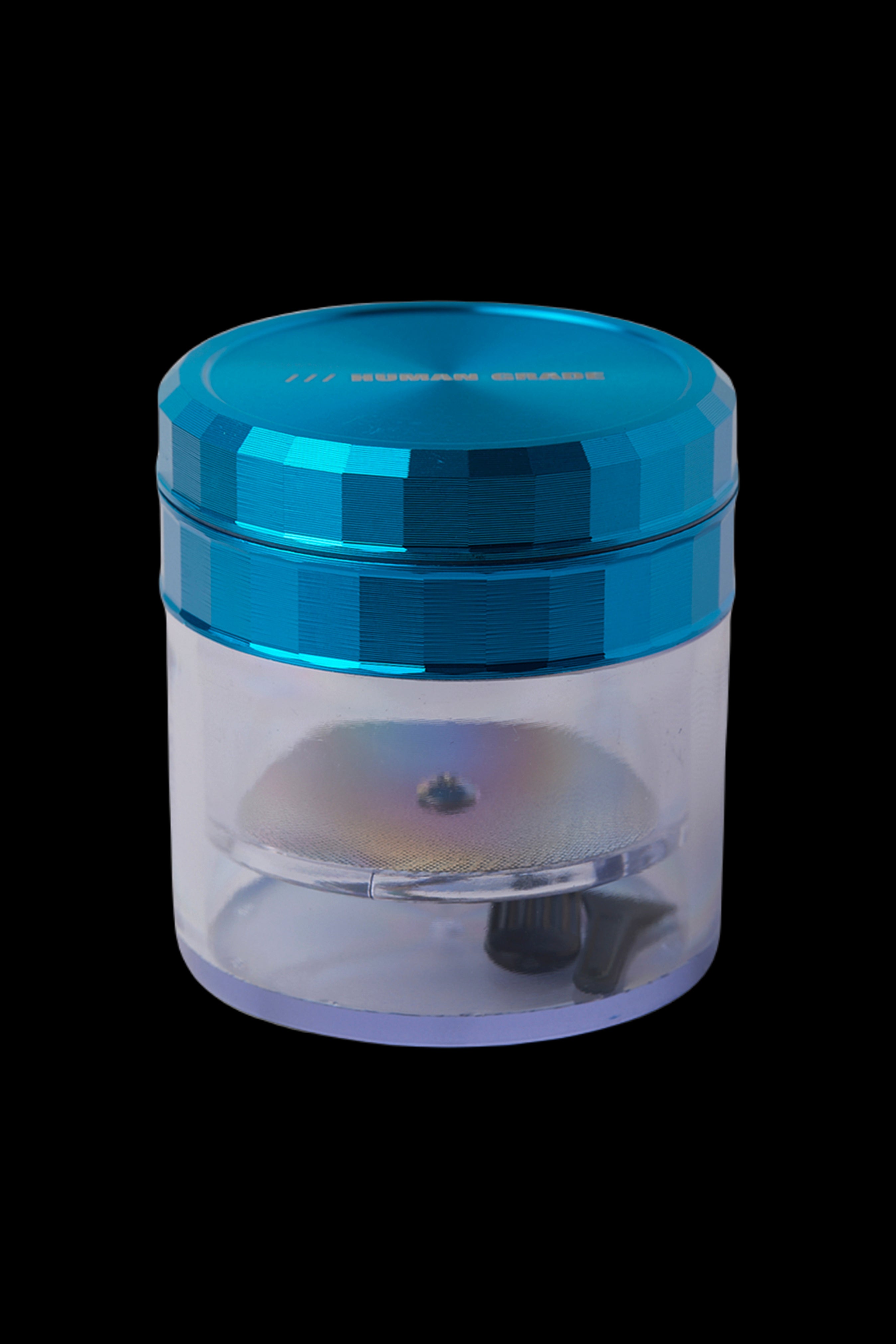 Blue and iridescent cannabis grinder isolated on a black background.