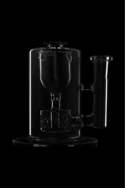 Clear glass dab rig and water pipe set against a black background.