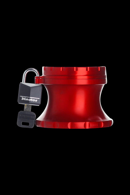 Red, airtight cannabis storage jar secured with a padlock and key, isolated on a black background."