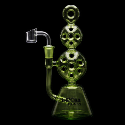 Close-up front view of the Croia Glass 8" Triple Stack Swiss Perc Recycler Dab Rig showing its translucent blue-green stacked spherical chambers and clear banger against a black background