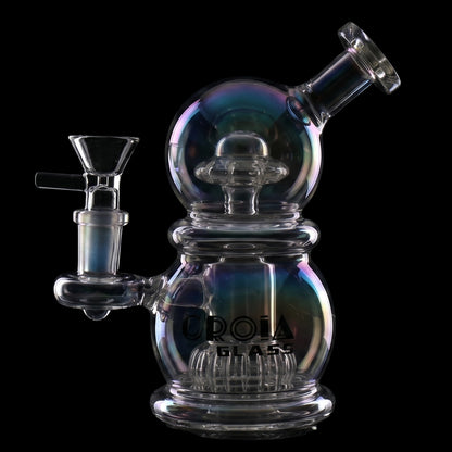 Angled close-up of the rainbow-toned Croia Glass 6" Mini Egg Dab Rig with Crown Perc against a black background.