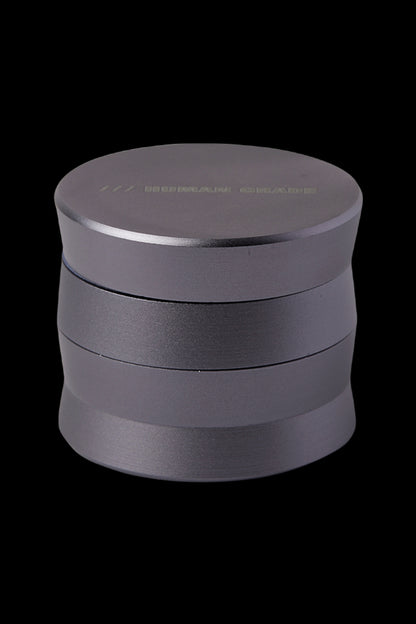 Black four-piece cannabis grinder.