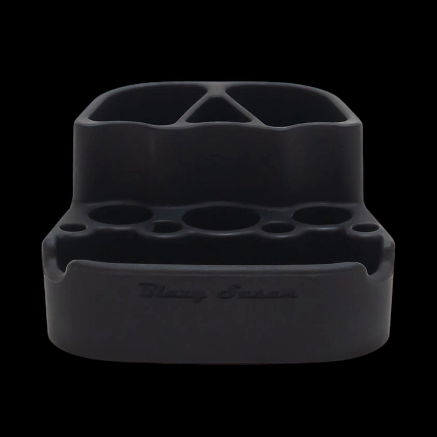 Close-up front view of the Blazy Susan Dab Station in red showing its divided top compartments and multiple circular tool slots against a black background