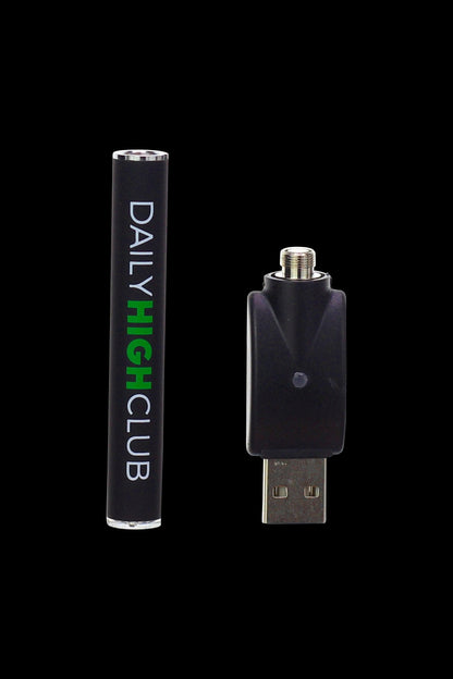 Cannabis vape pen and USB charger on a black background.