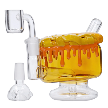 A front view of the "Give Danks" Smoking Box, featuring a transparent glass body with orange accents, illuminated against a white background.