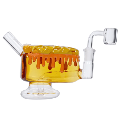 A front view of the “Give Danks” Smoking Box, showcasing a clear glass chamber with melted amber-colored accents and a curved neck joint.