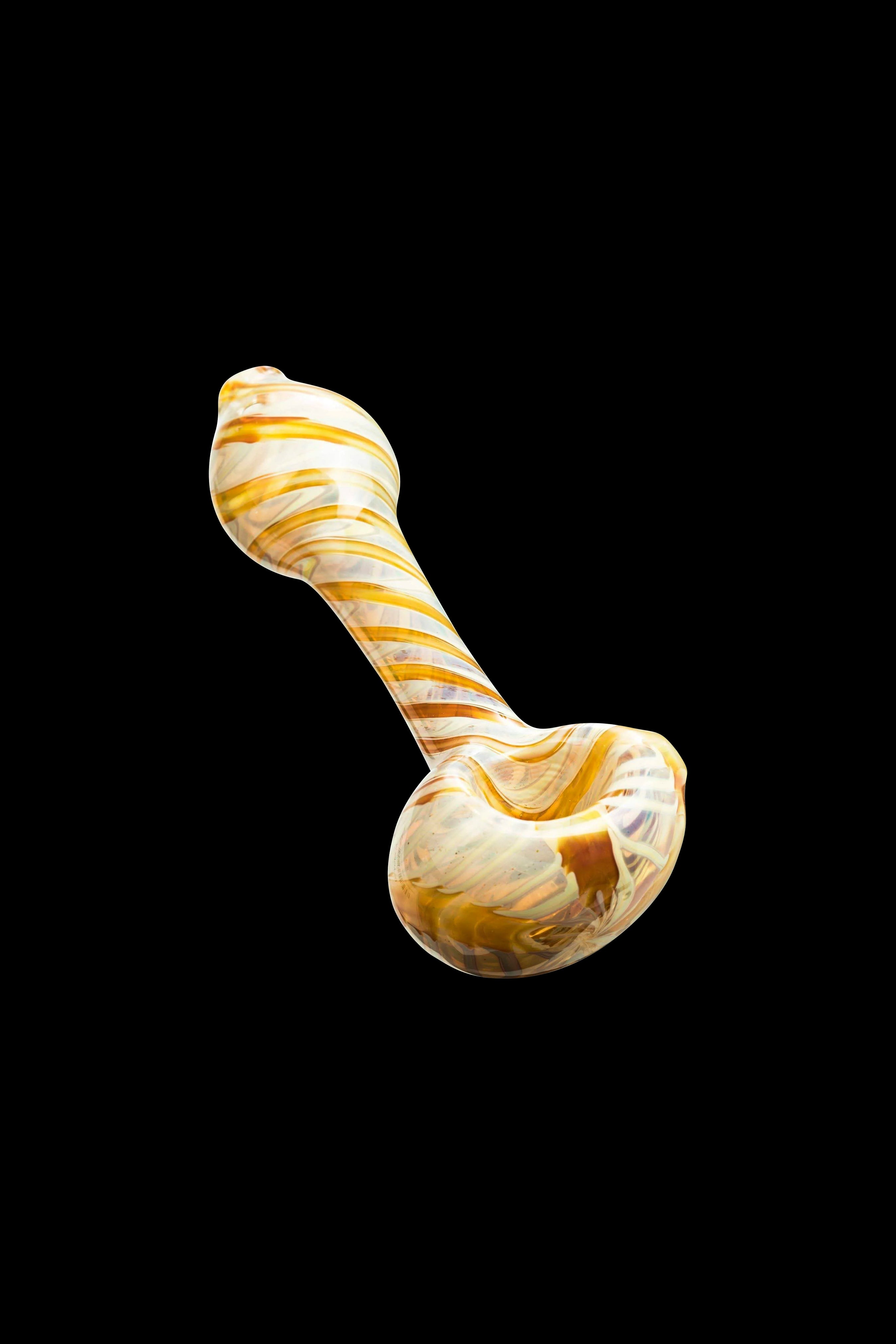 Hand pipe with cream and orange swirls against a black background.