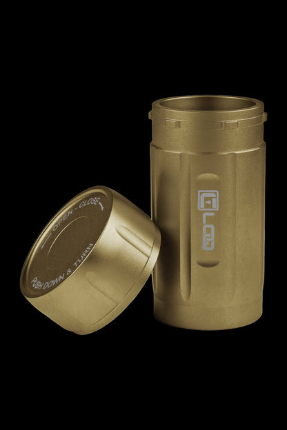 Gold cannabis storage container with lid partially detached, displaying “open-close” and “push down & turn” instructions.