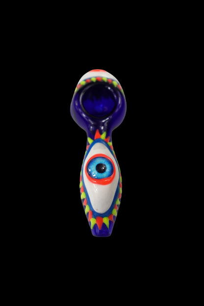 Colorful glass pipe with an eye design against a black background.