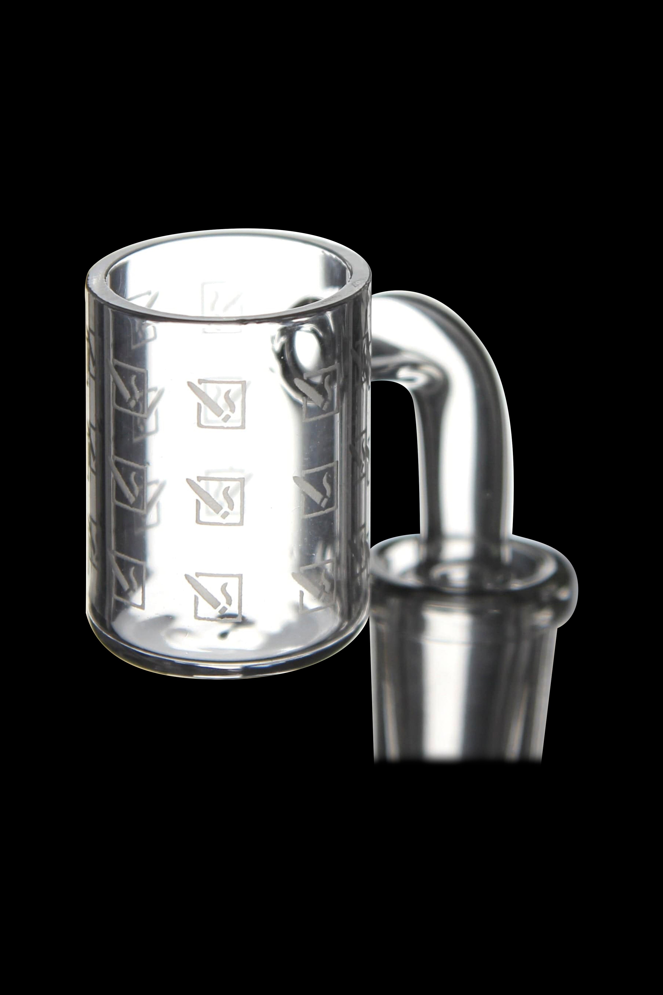 Clear glass dab rig with etched designs.