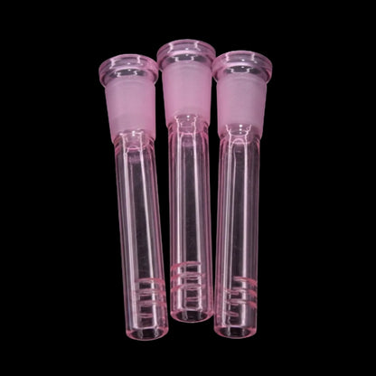 Close-up front view of three pink Smoke Cartel Color Diffused Downstem - 3 in. glass diffusers aligned vertically against a black background.