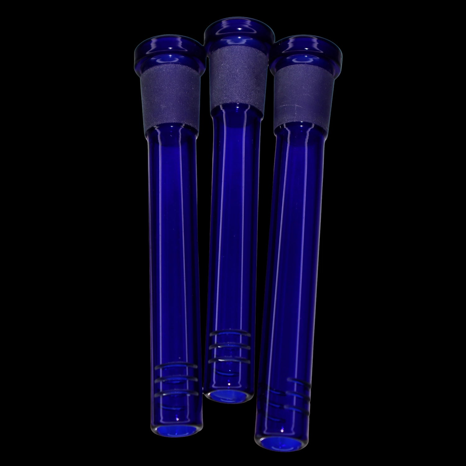 Close-up front view of three blue glass Smoke Cartel Color Diffused Downstem - 3.5 in. tubes against a black background.