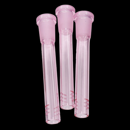Close-up front view of three pink Smoke Cartel Color Diffused Downstem - 3.5 in. glass stems against a black background.