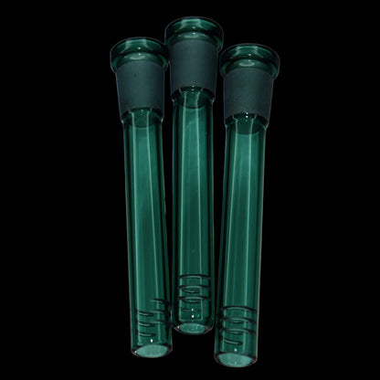 Close-up front view of three teal Smoke Cartel Color Diffused Downstem - 3.5 in. tubes against a black background, showing frosted joints and smooth glass shafts.