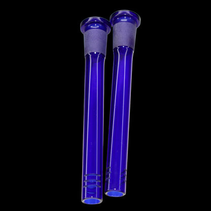 Close-up of two blue Smoke Cartel Color Diffused Downstem - 4.5 in. tubes shown vertically against a black background, lit from front.