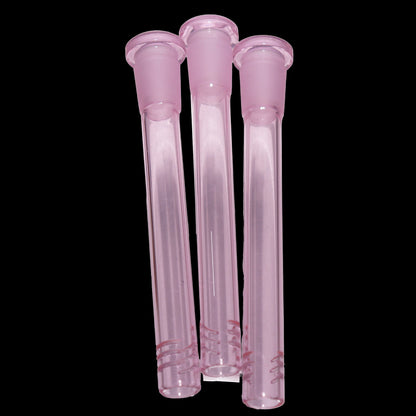 Close-up front view of three pink Smoke Cartel Color Diffused Downstem - 4.5 in. tubes clustered against a black background.