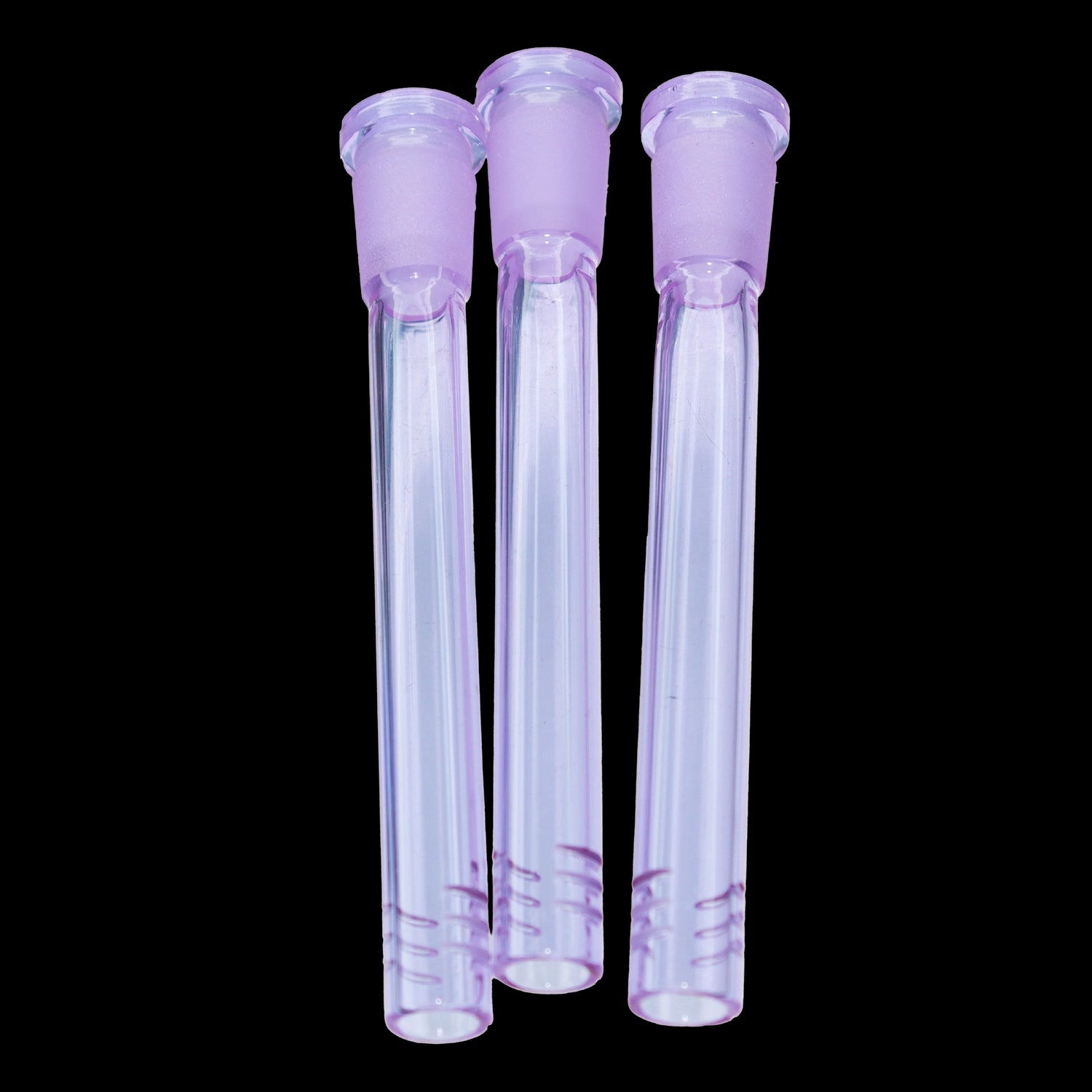 Close-up front view of three purple Smoke Cartel Color Diffused Downstem - 4.5 in. glass tubes aligned vertically against a black background.