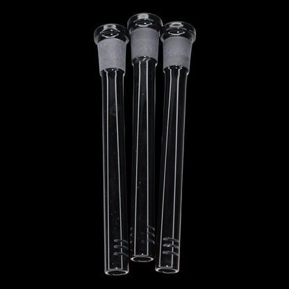 Close-up front view of three clear glass Smoke Cartel Color Diffused Downstem - 5 in. tubes with frosted joints, shown against a black background.