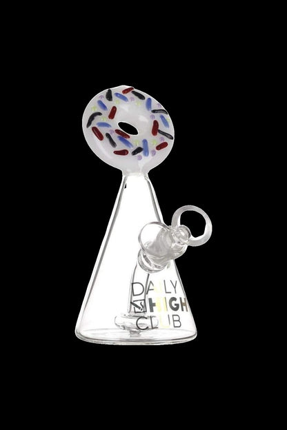 Clear glass oil rig with colorful patterned mouthpiece and “Daily High Club” branding.