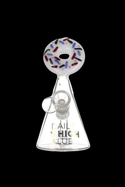 Glass oil rig shaped like a donut with branding text.