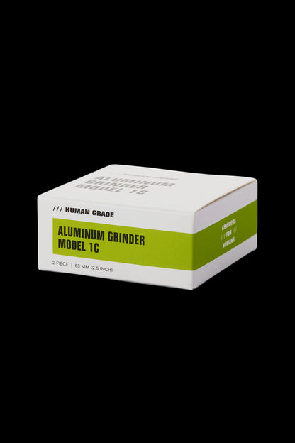 White box for an aluminum cannabis grinder, labeled “// HUMAN GRADE ALUMINUM GRINDER MODEL 1C” and “// FOR // HUMANS”.