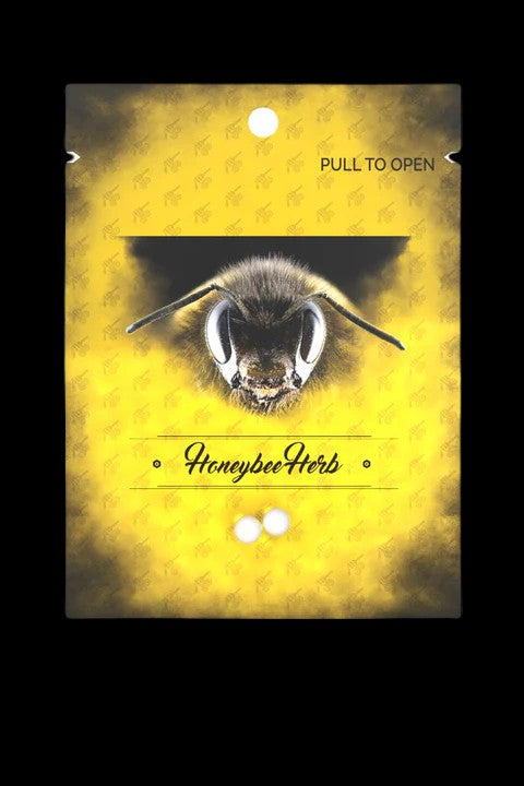 Close-up of a bee's face on a yellow textured background with the text "HoneybeeHerb."