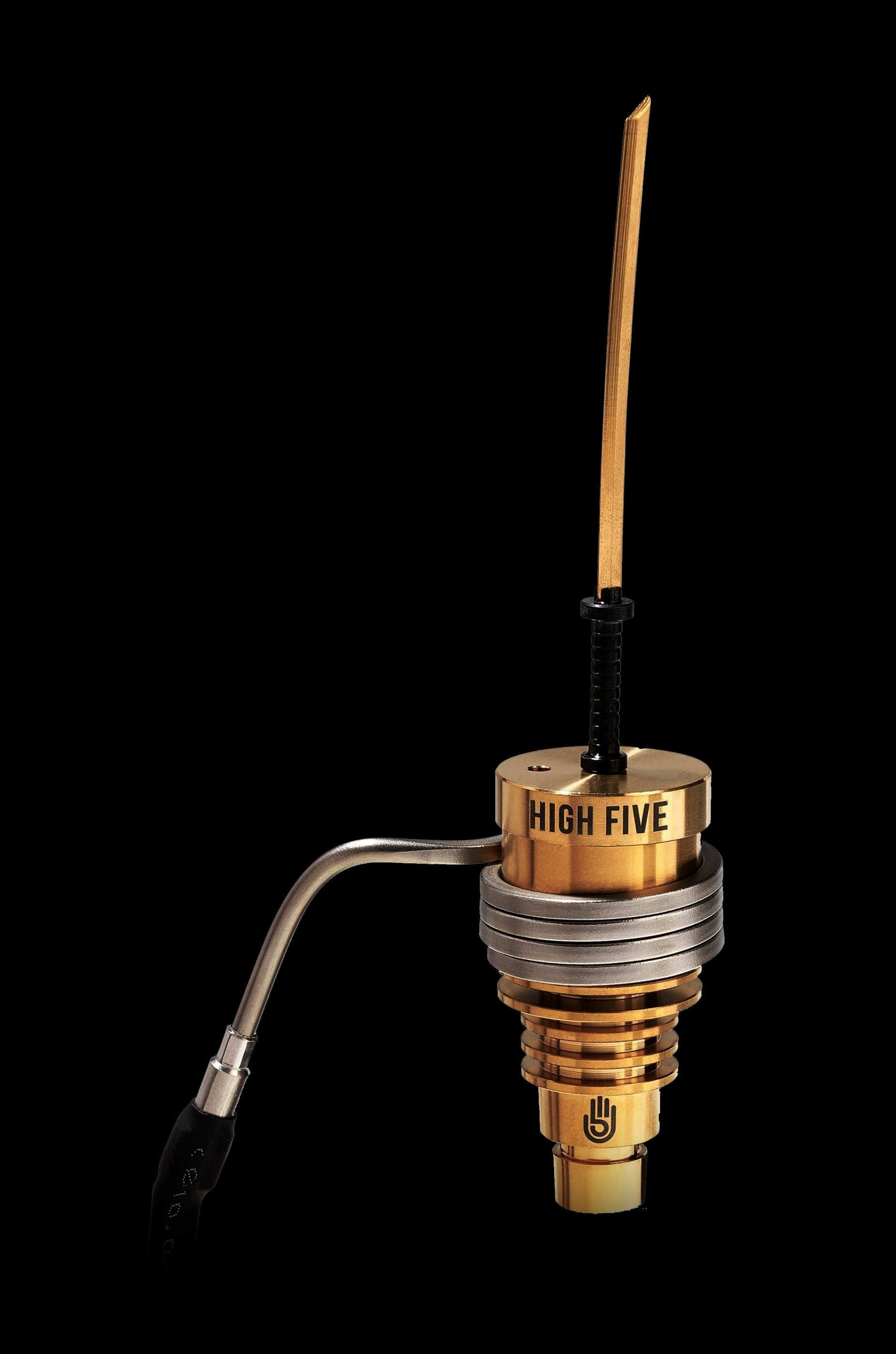 Gold cannabis oil rig attachment with a glass carb cap and coil.