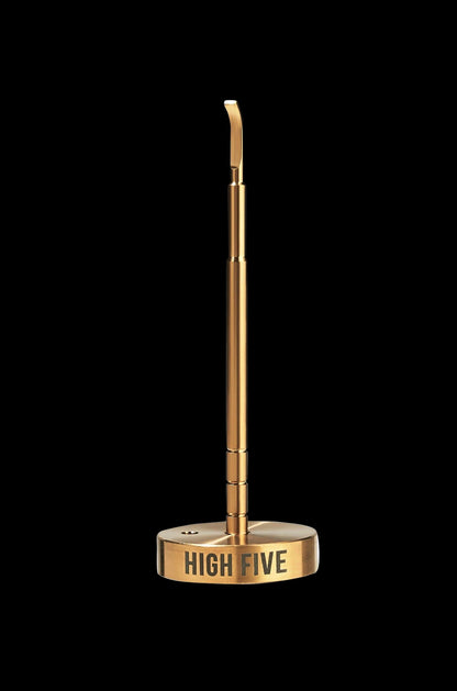 Gold cannabis oil applicator with “HIGH FIVE” branding on the base, isolated on a black background.