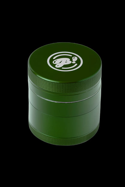 Green four-piece metal grinder with a logo on the lid.