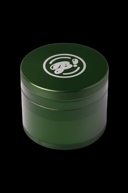 Green four-piece cannabis grinder with a white logo.