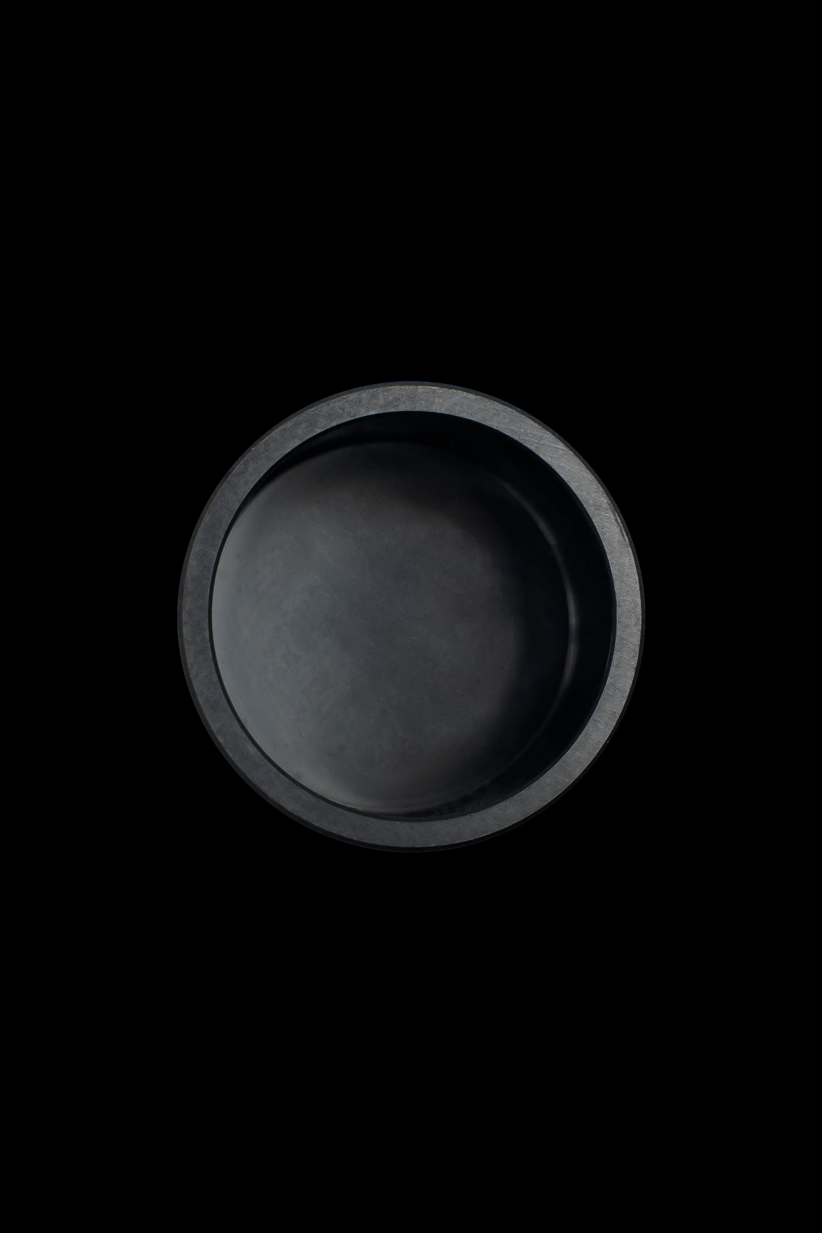 Black cannabis ashtray on a black background.