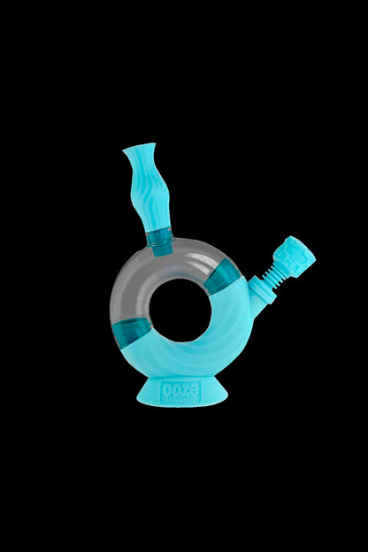 Blue glass bubbler water pipe with the brand "OOZE" printed on the base.
