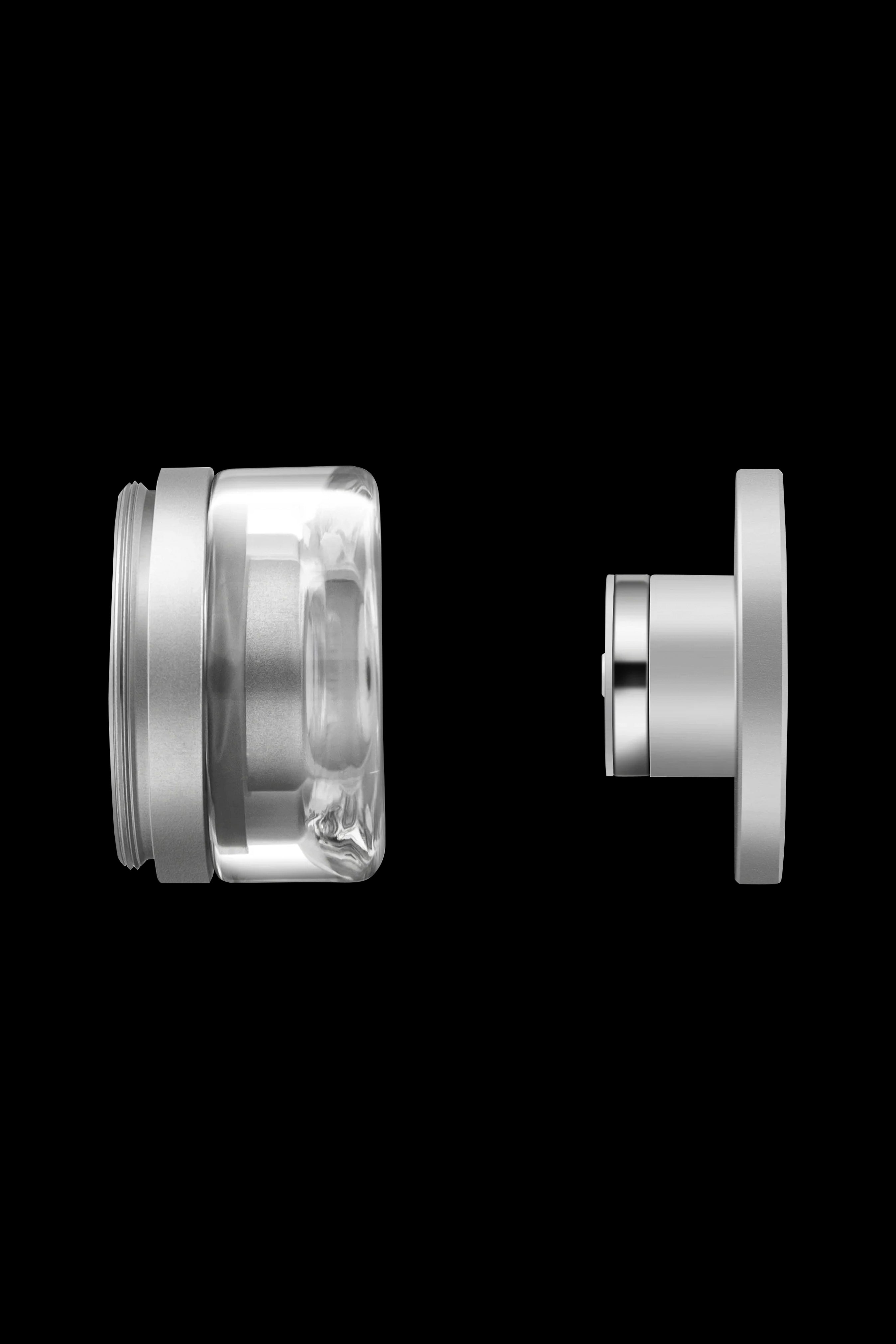 Disassembled glass and metal cannabis oil vape cartridge.