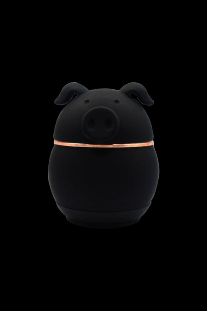 Black ceramic dab rig shaped like a pig with a glowing orange band around its midsection.