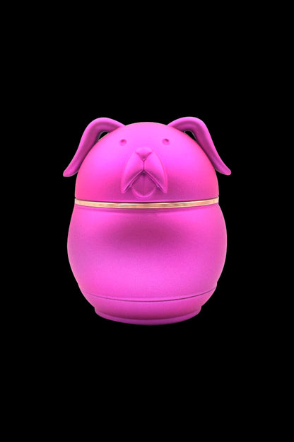 Bright pink dog-shaped stash jar with gold trim.