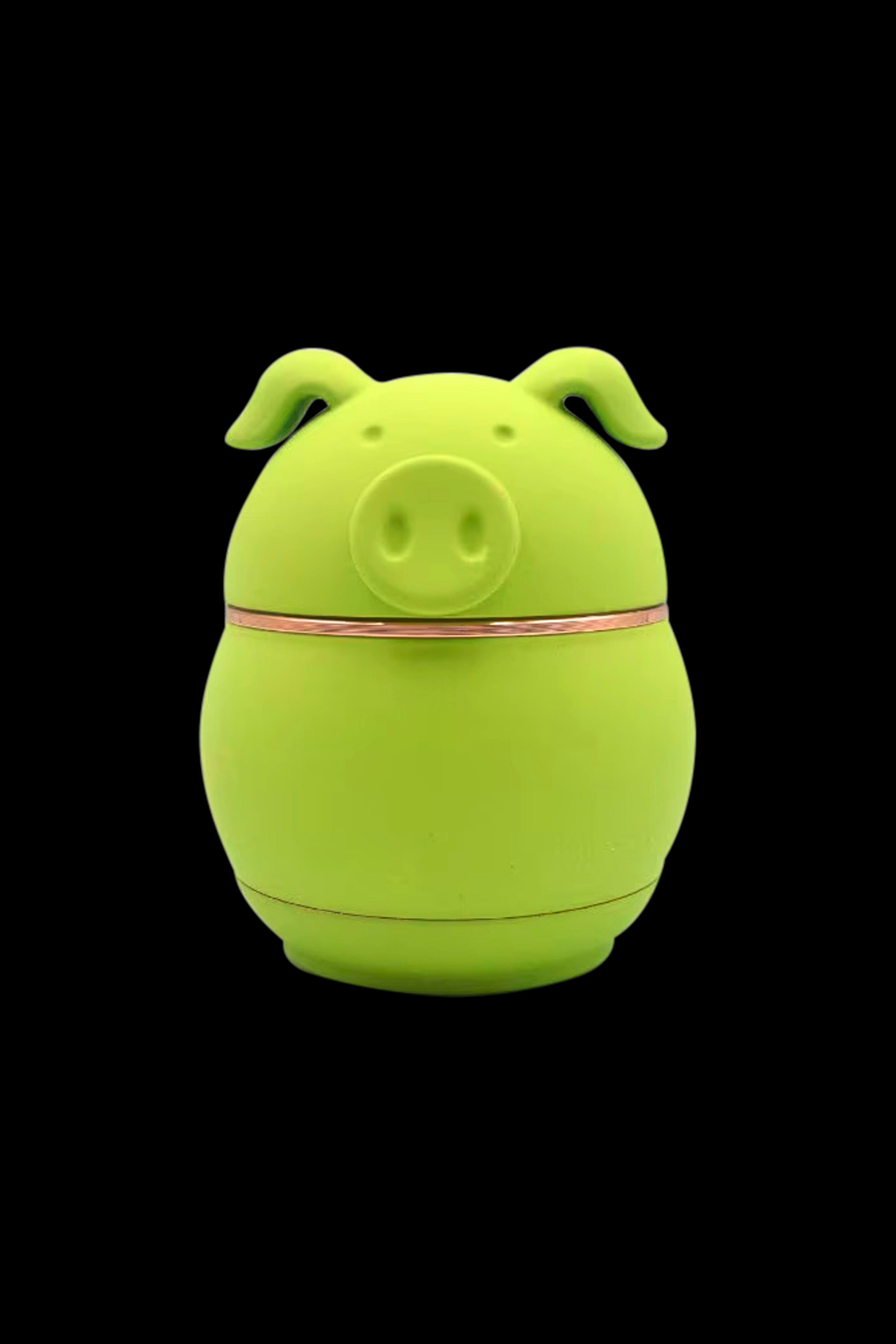 Green pig-shaped silicone container, likely for cannabis storage.