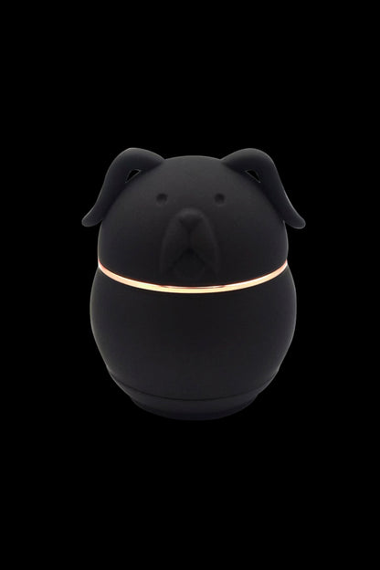 Black dog-shaped container with a golden band, likely for storing cannabis or accessories.