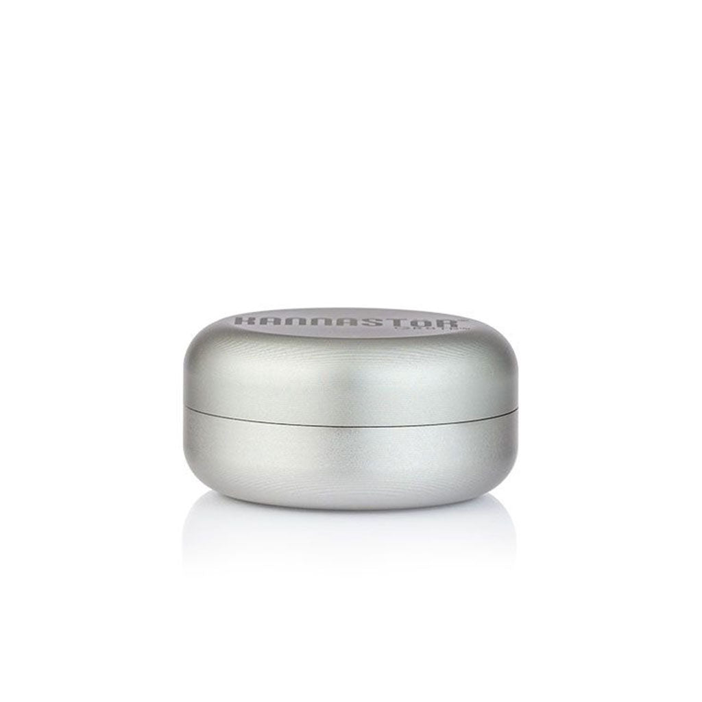 Centered front view of a metallic silver RYOT GR8TR Jar Body Grinder with a rounded, pillbox shape and soft studio lighting.