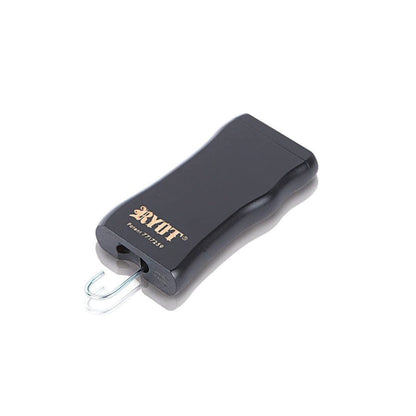 Angled top-down view of the RYOT Wooden Magnetic Dugout With Matching One Hitter showing the black wooden case with gold logo and the metal one-hitter partially ejected