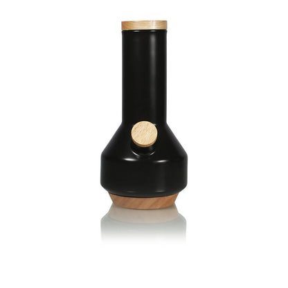 Front view of the RYOT Ceramic Maple Traveller Pipe in black with wood-toned accents, centered against a white reflective background.