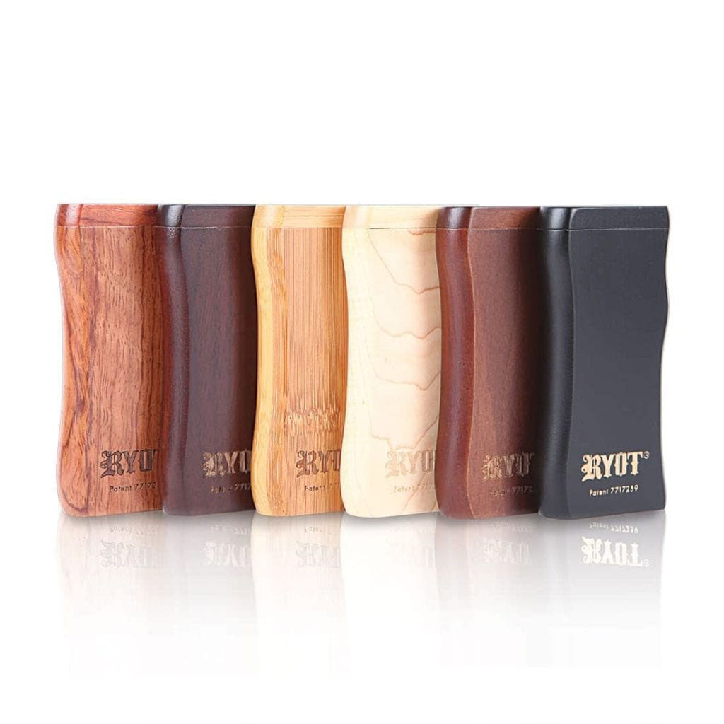 Front-facing lineup of six RYOT Wooden Magnetic Dugout With Matching One Hitter cases in varying wood tones, reflected on a white surface.