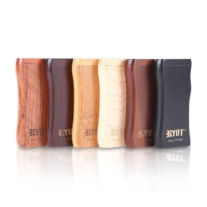 Front-facing lineup of six RYOT Wooden Magnetic Dugout With Matching One Hitter cases in varying wood tones, reflected on a white surface.