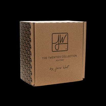 Brown packaging box for "The Twenties Collection" ashtray by Jane West, featuring a repeating geometric pattern on the side.