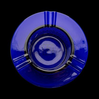 Blue glass cannabis bong viewed from above, creating a swirling, hypnotic pattern.