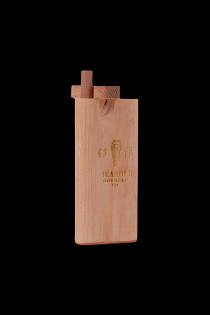 Wooden one-hitter pipe with engraved branding.