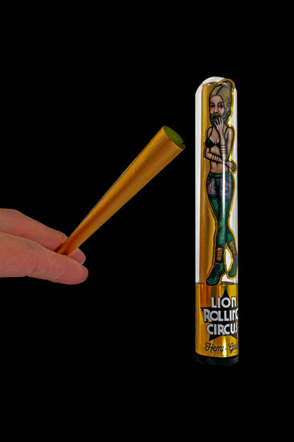 A hand holding a partially rolled, tan rolling paper next to a metal tin decorated with a vintage-style circus performer and labeled “Lion Rolling Circus.”