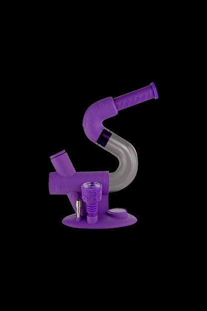 Purple glass rig with bowl and nail for dabbing cannabis concentrates.