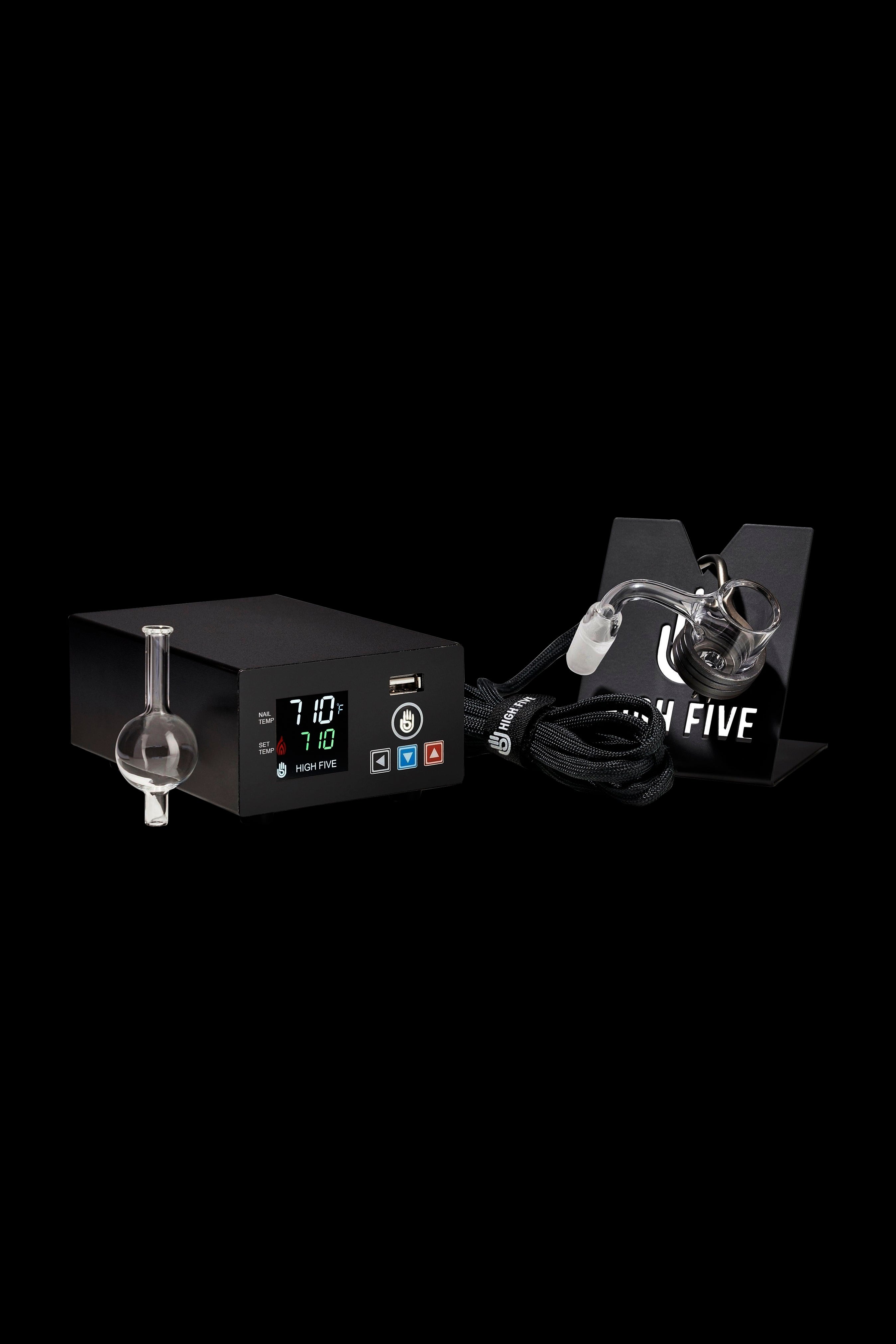 Digital dab rig with glass bubbler and accessories, displayed against a black background.