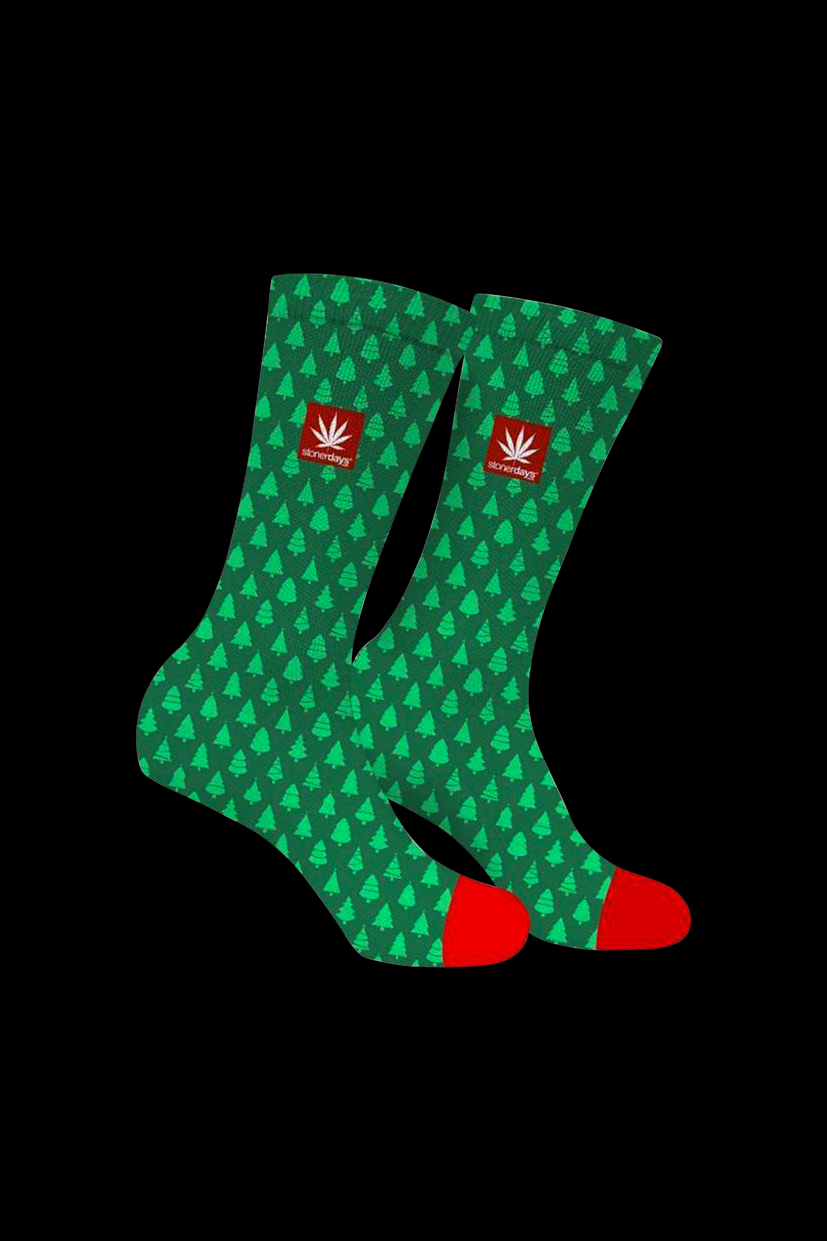 Green socks with a repeating cannabis leaf pattern and red toes and cuffs, branded with “stonerdays”.