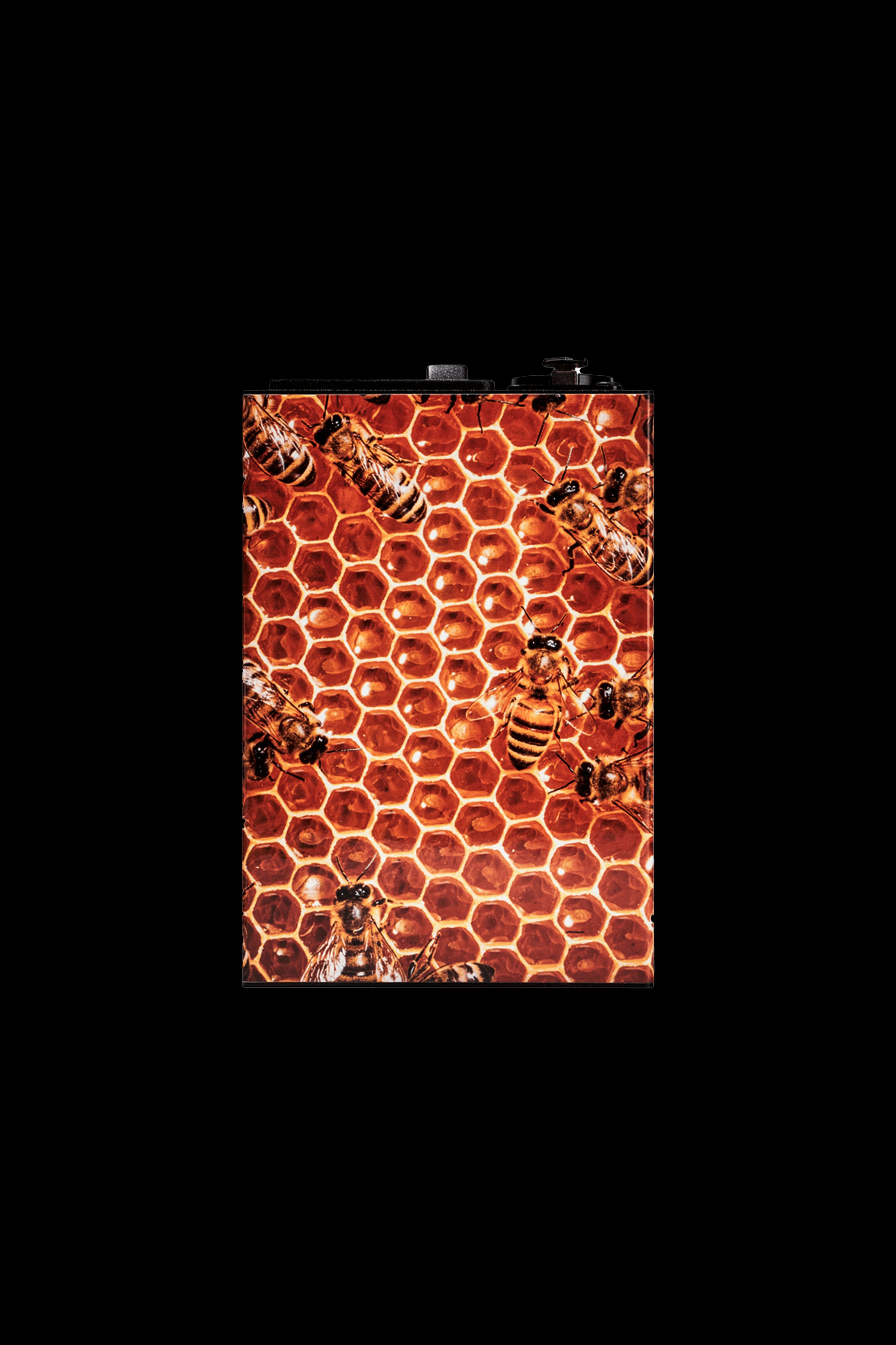 Close-up of a cannabis accessory case patterned with a honeycomb design and busy bees.